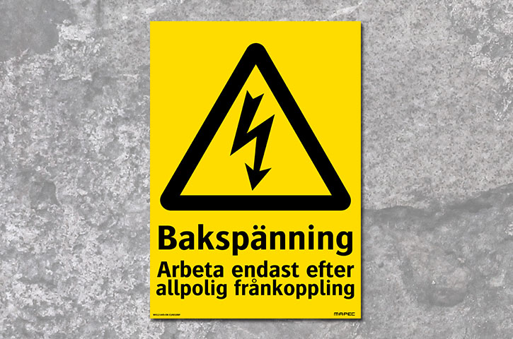 Elskylt som varnar för bakspänning.